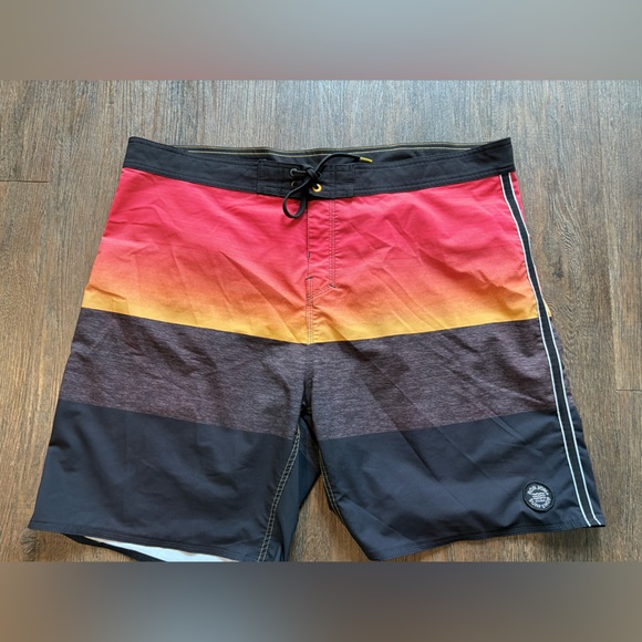 Size 40 Ron Jon surf shop board shorts.  Black, orange, grey.  Drawstring waist. - Picture 1 of 7